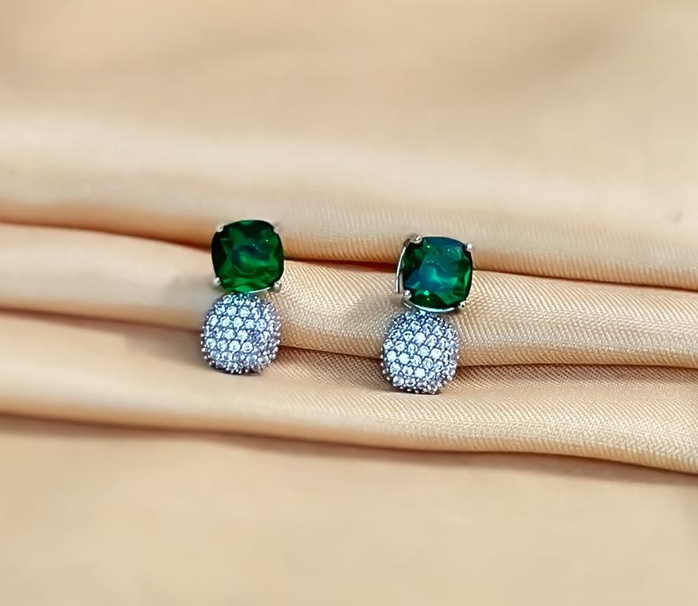 Emerald Enchantment: Statement Studs with Radiant Diamonds for a Touch of Luxury